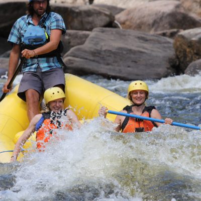 a man on a raft in a body of water