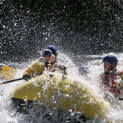 a person riding a wave on top of a body of water