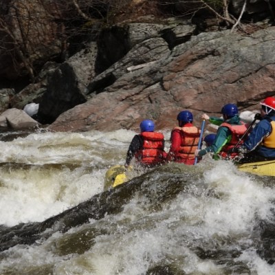 a man in a raft on the water