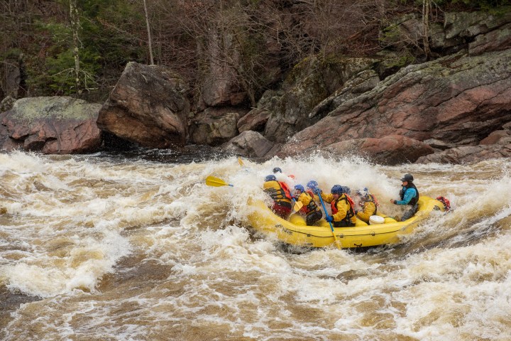 a person riding a wave on top of a mountain