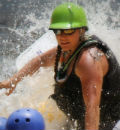 a man riding a wave on a surfboard in the water