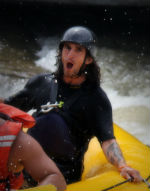 a person riding a snow board in the water