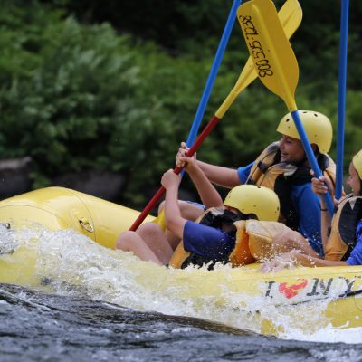 a person riding on the back of a boat