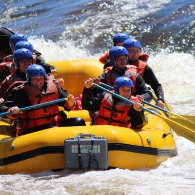 a group of people on a raft in the water
