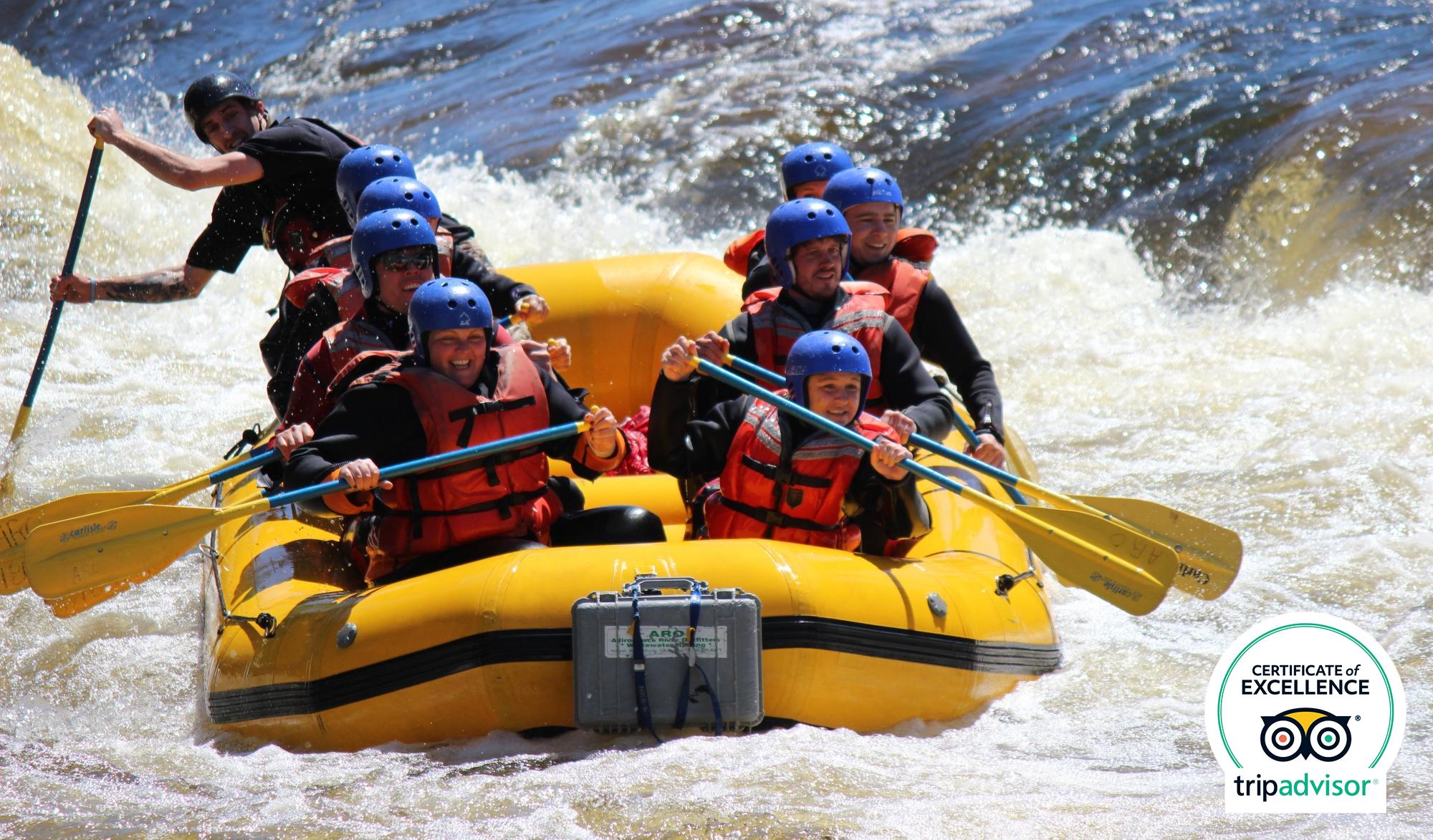 adirondack-river-outfitters a group of people on a raft in the water