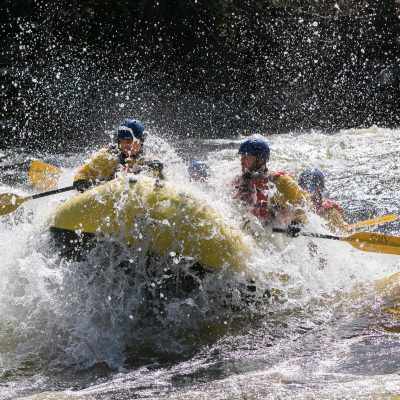 a man riding a wave on a surfboard in the water