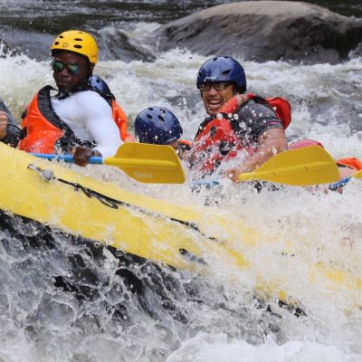 a man riding a snow board in the water
